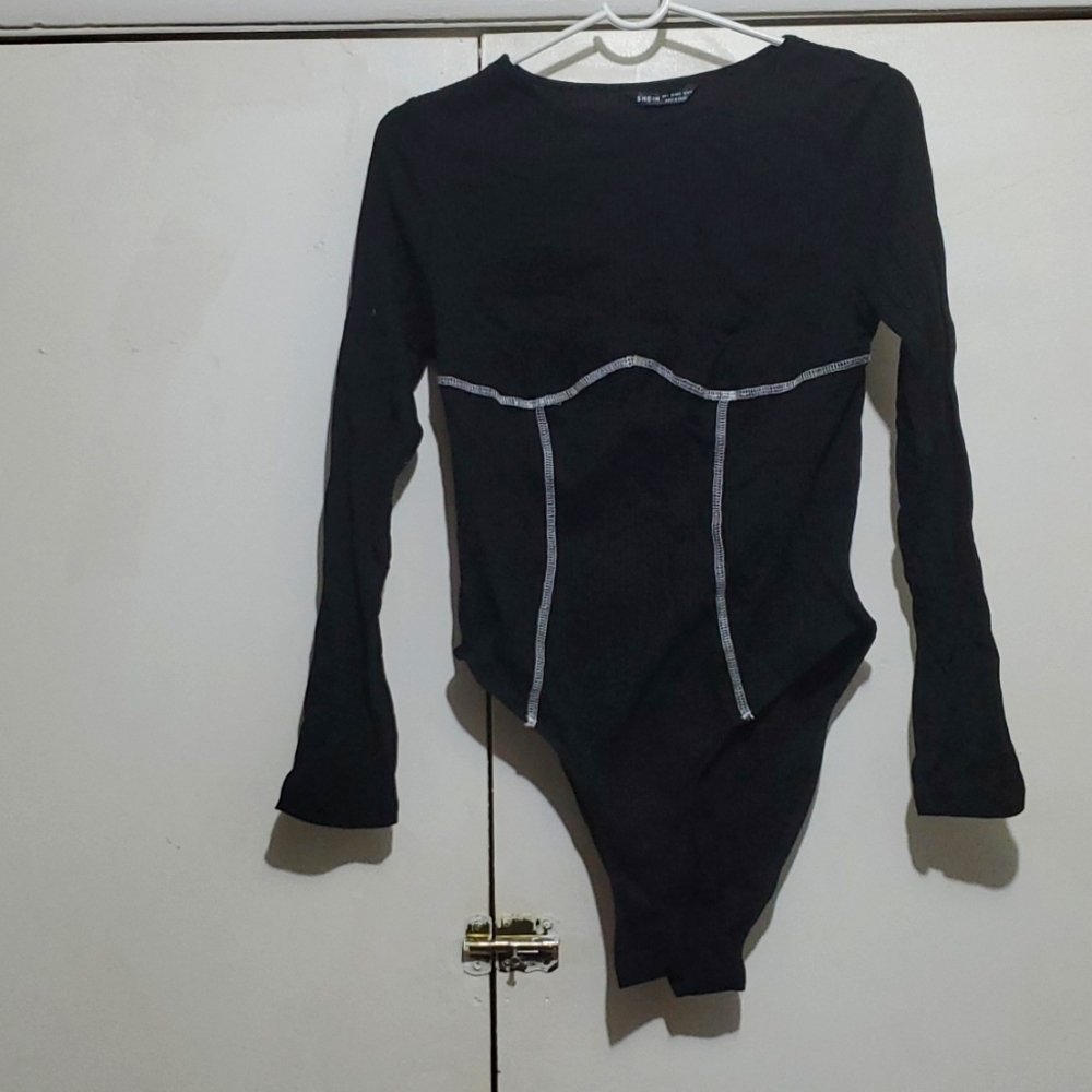 Black bodysuit with white stitching detail
